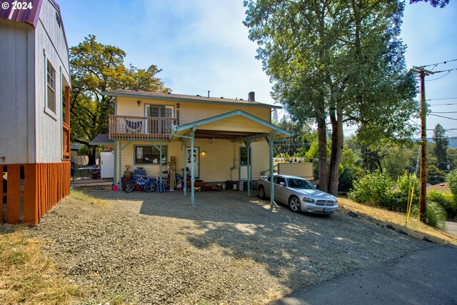 view of front of home with a balcony