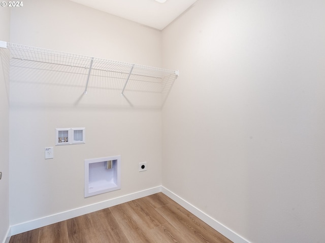 laundry room featuring hookup for an electric dryer, hookup for a washing machine, and hardwood / wood-style floors