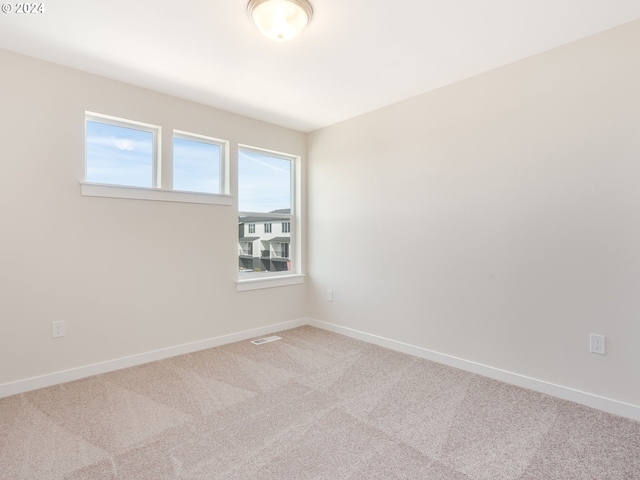 unfurnished room with carpet