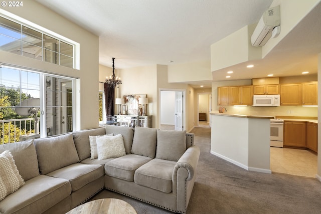 carpeted living room featuring a high ceiling, a chandelier, and an AC wall unit