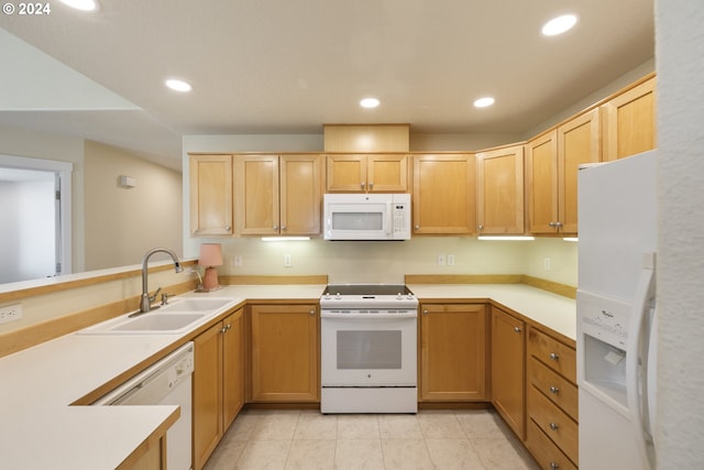 kitchen featuring light brown cabinets, light tile patterned flooring, sink, and white appliances