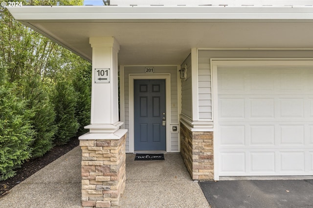 property entrance with a garage