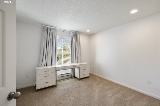 unfurnished office with light colored carpet and a textured ceiling