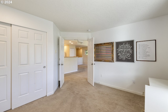 interior space with a textured ceiling