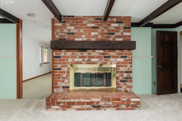 interior space featuring a textured ceiling, a fireplace, and carpet