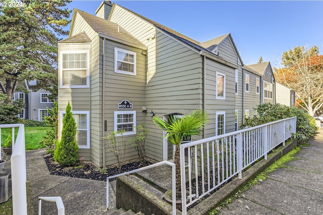 8550 SW Curry Dr Unit A, Wilsonville, OR 97070 - view of property exterior featuring a shingled roof