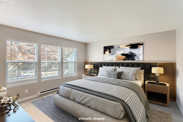 8550 SW Curry Dr Unit A, Wilsonville, OR 97070 - carpeted bedroom with a baseboard heating unit and baseboards