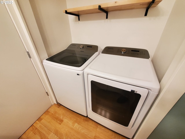 8550 SW Curry Dr Unit A, Wilsonville, OR 97070 - washroom with independent washer and dryer and light wood-type flooring