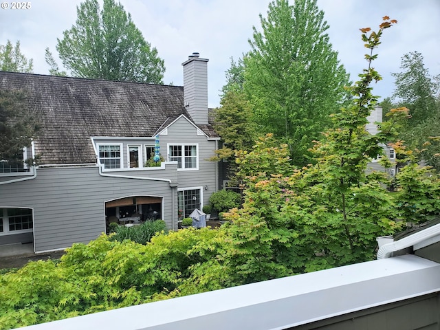 8550 SW Curry Dr Unit A, Wilsonville, OR 97070 - view of front facade with a chimney