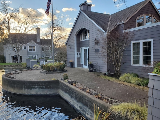 8550 SW Curry Dr Unit A, Wilsonville, OR 97070 - back of property with a chimney