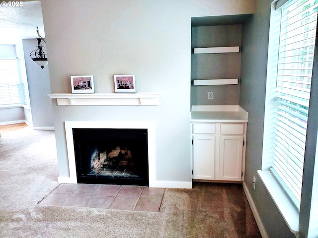 8550 SW Curry Dr Unit A, Wilsonville, OR 97070 - unfurnished living room featuring carpet floors, plenty of natural light, and baseboards