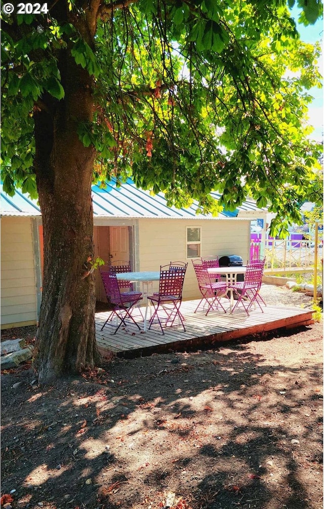 exterior space with fence and a deck