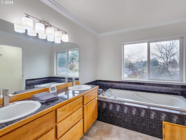 bathroom with tiled tub, crown molding, and vanity