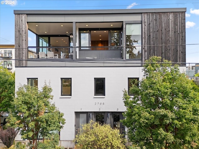 view of home's exterior featuring a balcony