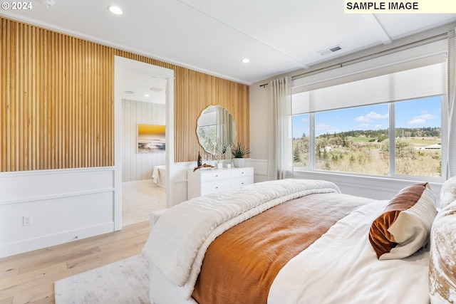 bedroom with light wood-style flooring, visible vents, and recessed lighting