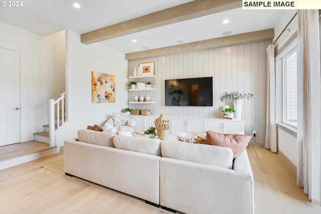 living room featuring light wood finished floors, stairway, beam ceiling, and recessed lighting