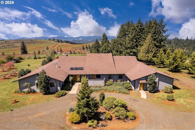 drone / aerial view featuring a mountain view