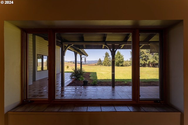 doorway to outside with a mountain view