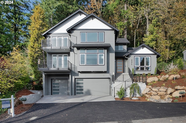 view of front facade featuring a balcony and a garage