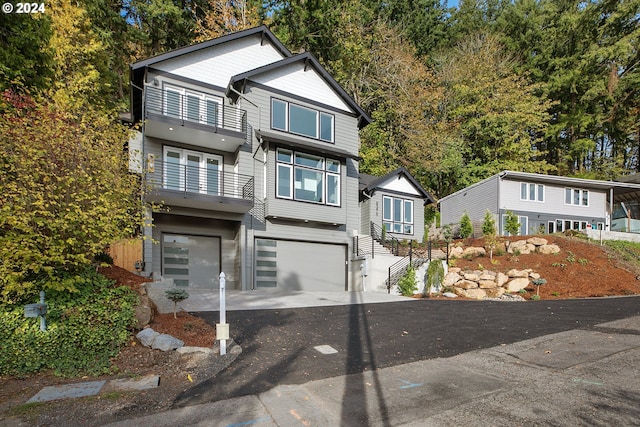 view of front of property with a garage and a balcony