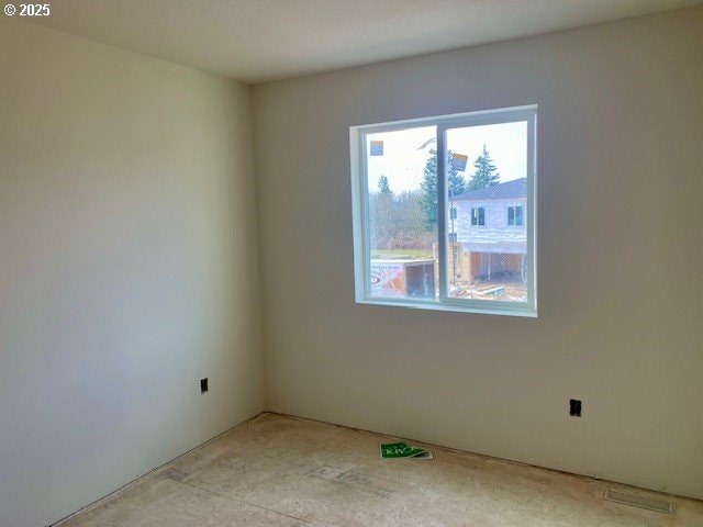 spare room featuring visible vents