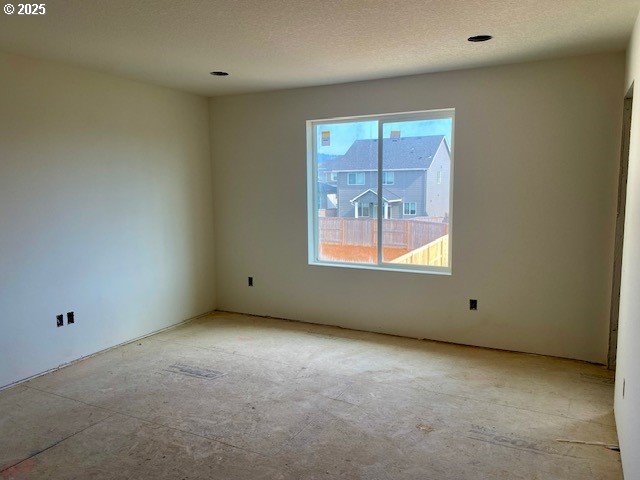 spare room featuring a textured ceiling