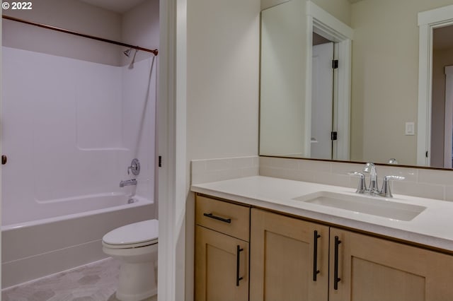 full bathroom featuring shower / washtub combination, vanity, and toilet