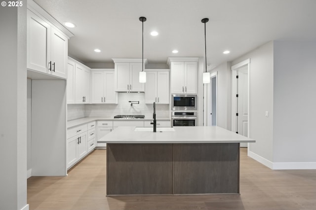 hall featuring light wood-type flooring and sink