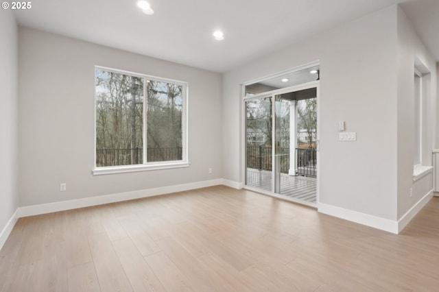 carpeted spare room with a raised ceiling