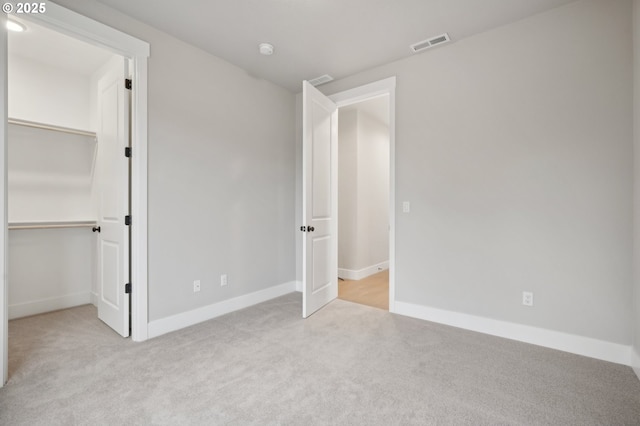 bathroom with vanity, toilet, wood-type flooring, and a shower with shower door