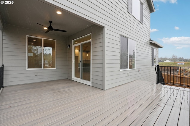 wooden terrace featuring ceiling fan