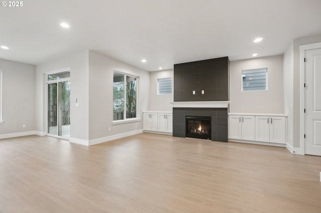 unfurnished living room featuring dark hardwood / wood-style flooring and sink