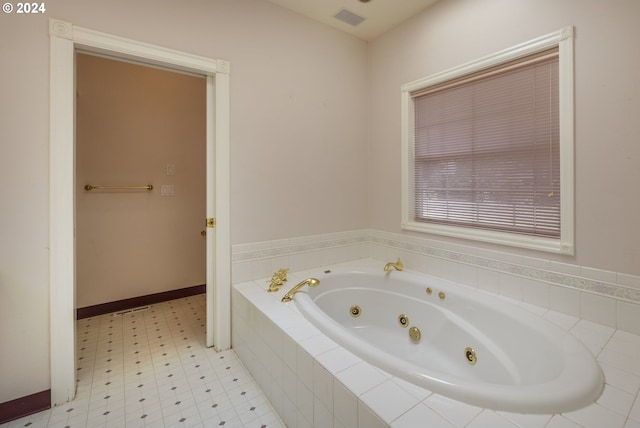 bathroom with tiled bath