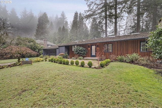 view of front of home with a front lawn