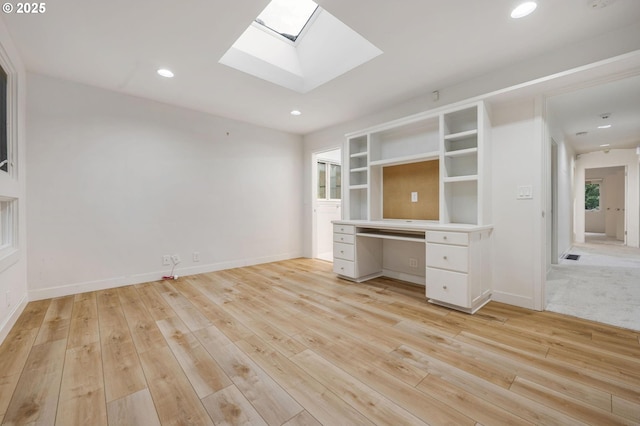 unfurnished office featuring light hardwood / wood-style flooring