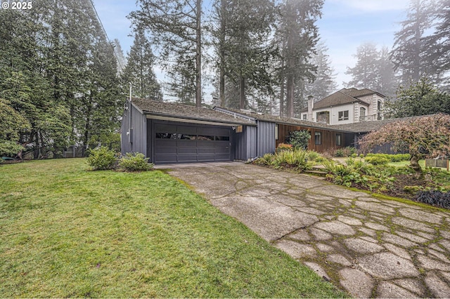 view of front facade with a front yard and a garage