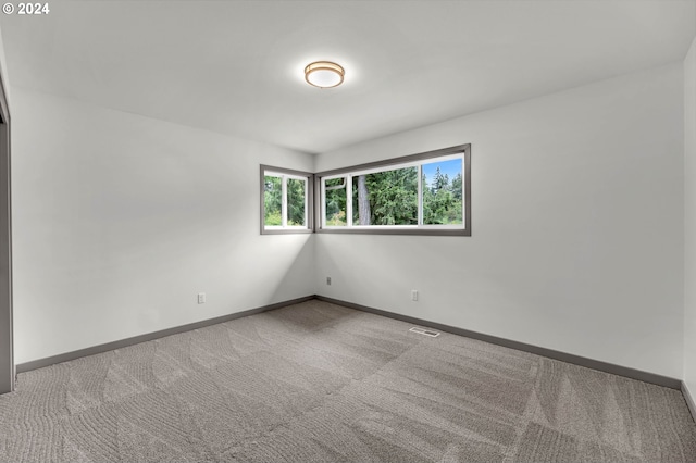 empty room with light colored carpet