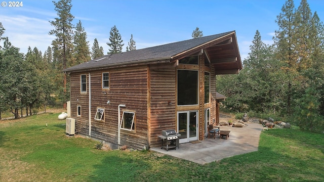 view of home's exterior with a lawn and a patio