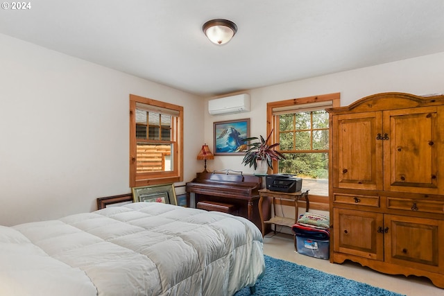 bedroom featuring an AC wall unit