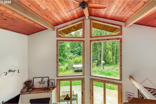 entryway with vaulted ceiling with beams, ceiling fan, wood ceiling, and a wealth of natural light