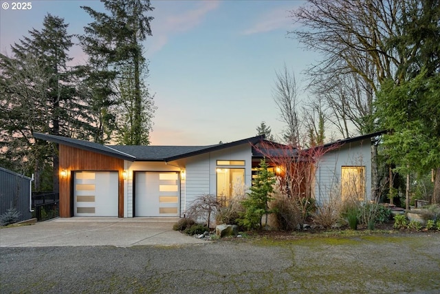 view of front facade with a garage and concrete driveway