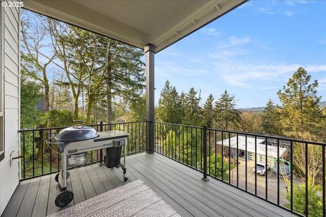 wooden deck featuring grilling area