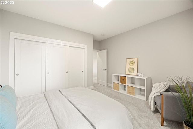 bedroom with light colored carpet and a closet