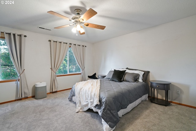 bedroom featuring ceiling fan and light colored carpet