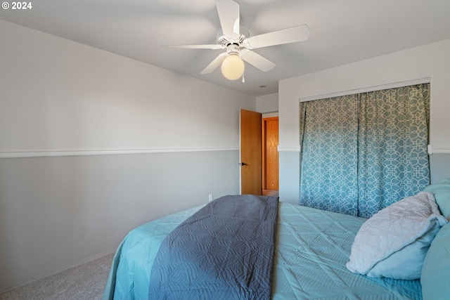 bedroom with ceiling fan and carpet floors