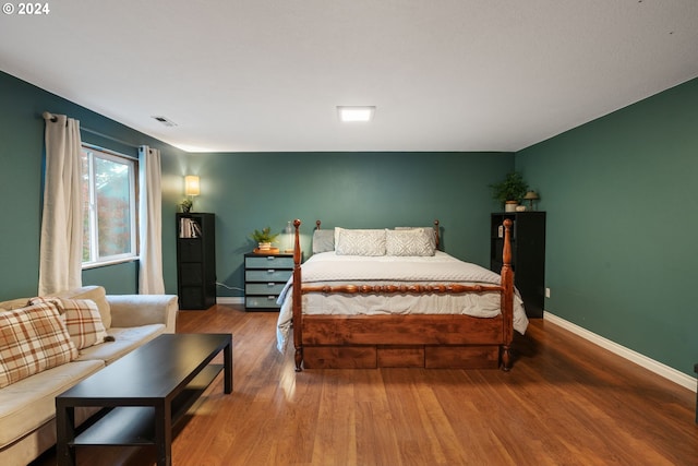 bedroom featuring wood-type flooring