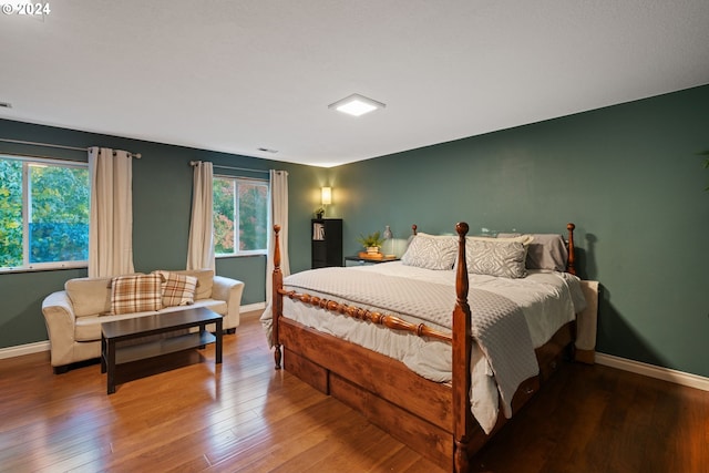 bedroom with hardwood / wood-style flooring