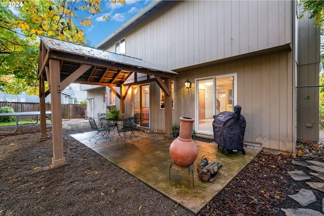 back of house with a patio area and a trampoline