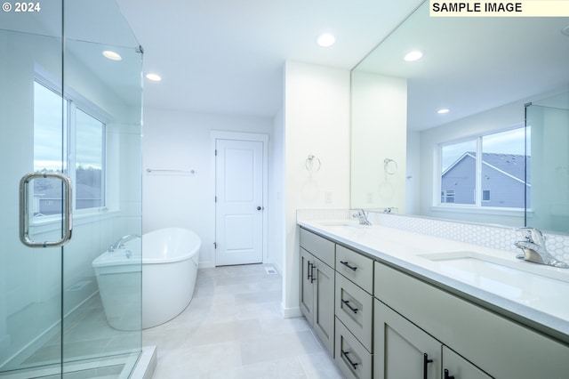 bathroom featuring tile patterned flooring, vanity, and independent shower and bath