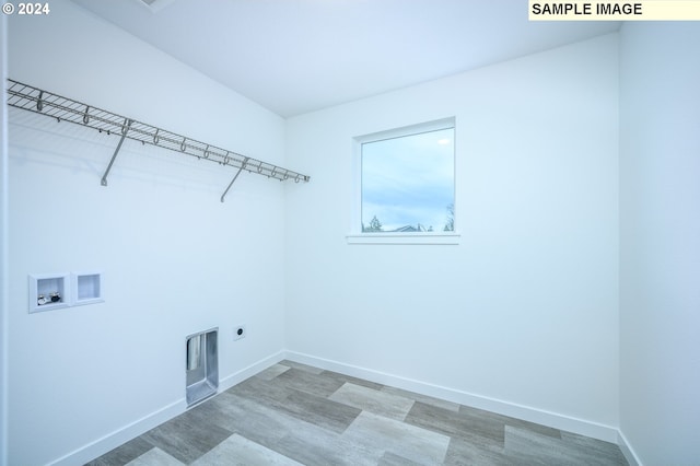 laundry room featuring washer hookup, hookup for an electric dryer, and hardwood / wood-style flooring